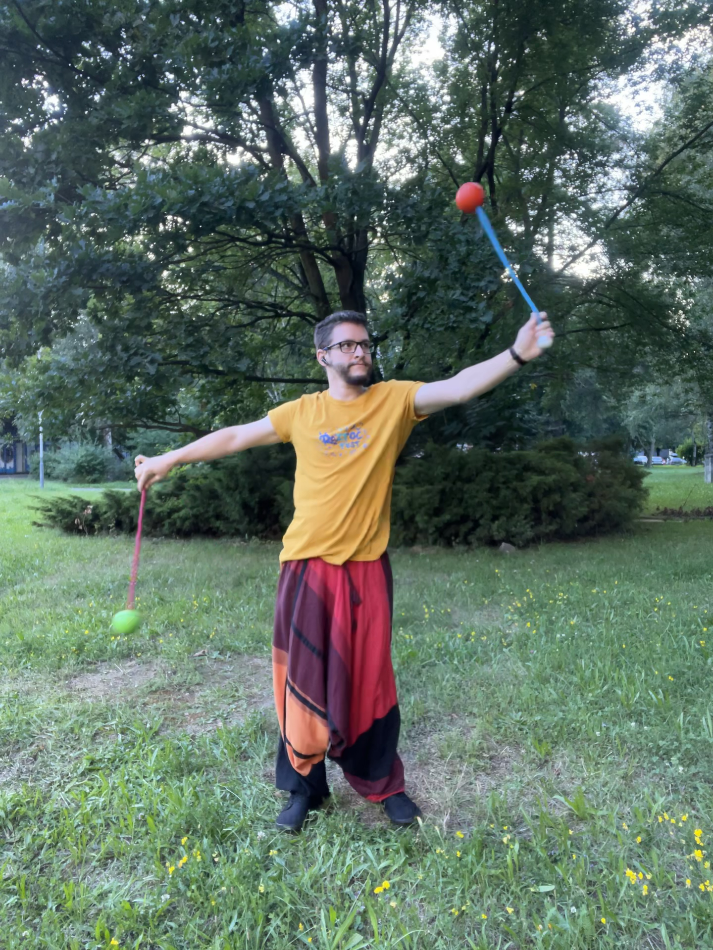 Matěj practicing with poi in the park