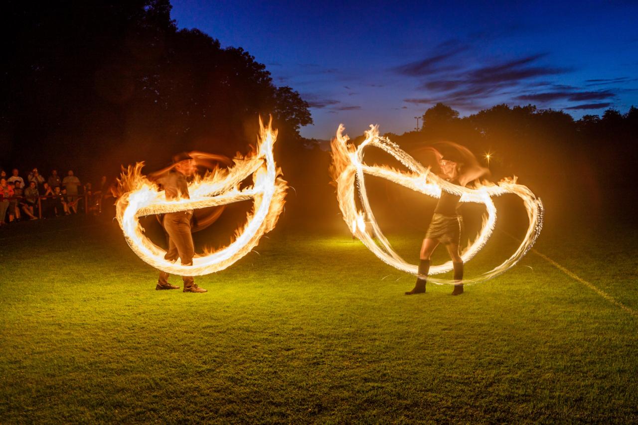 Matěj and Kača performing with fire poi at the Ostravice town festival 2023