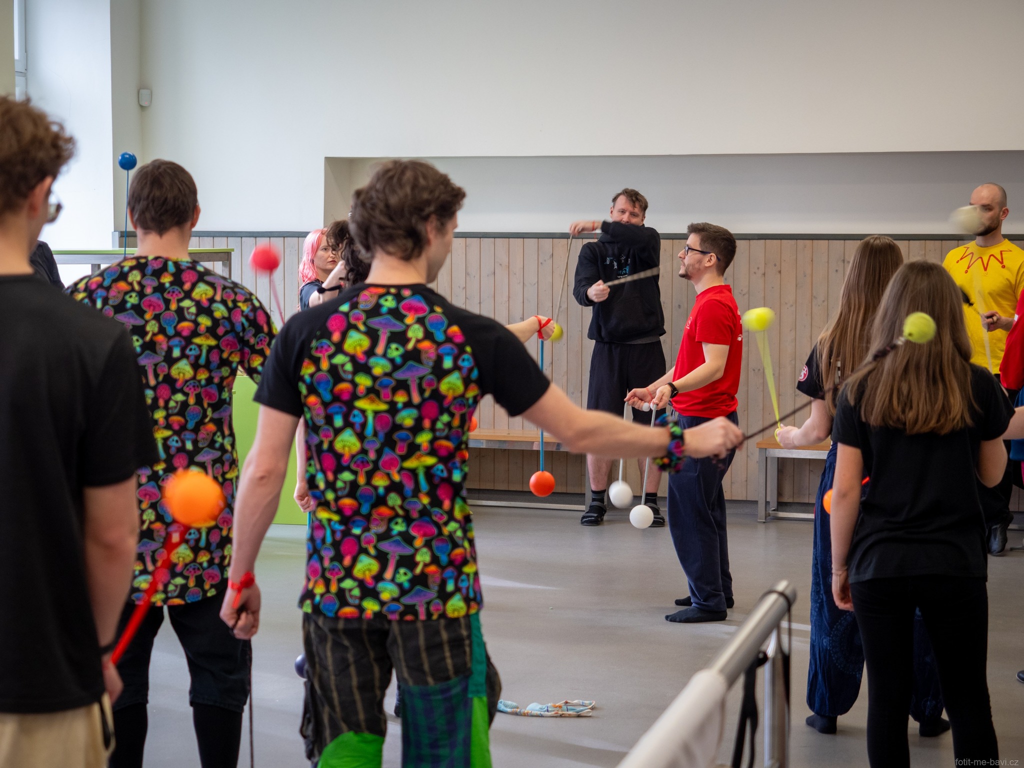 Matěj leading a poi workshop